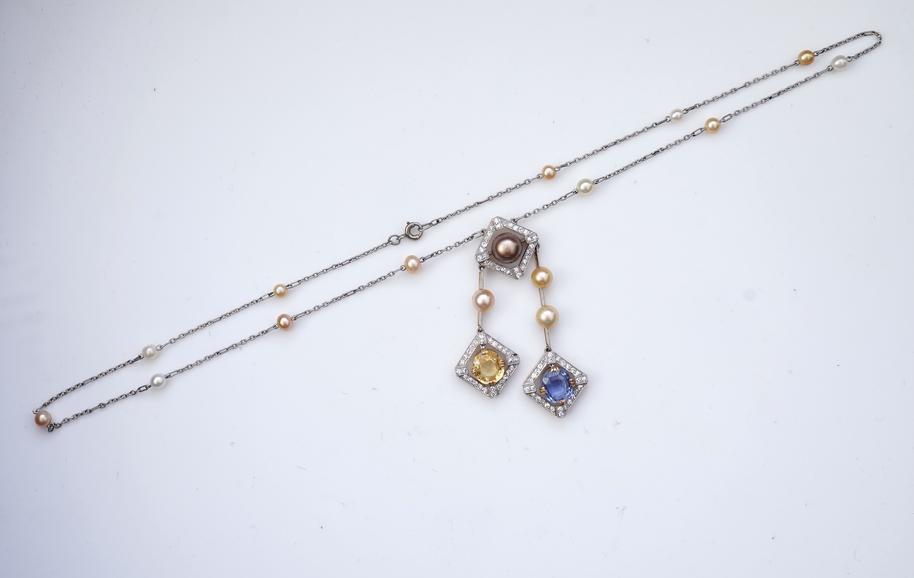 An Art Deco sapphire, natural pearl and diamond necklace, circa 1920
